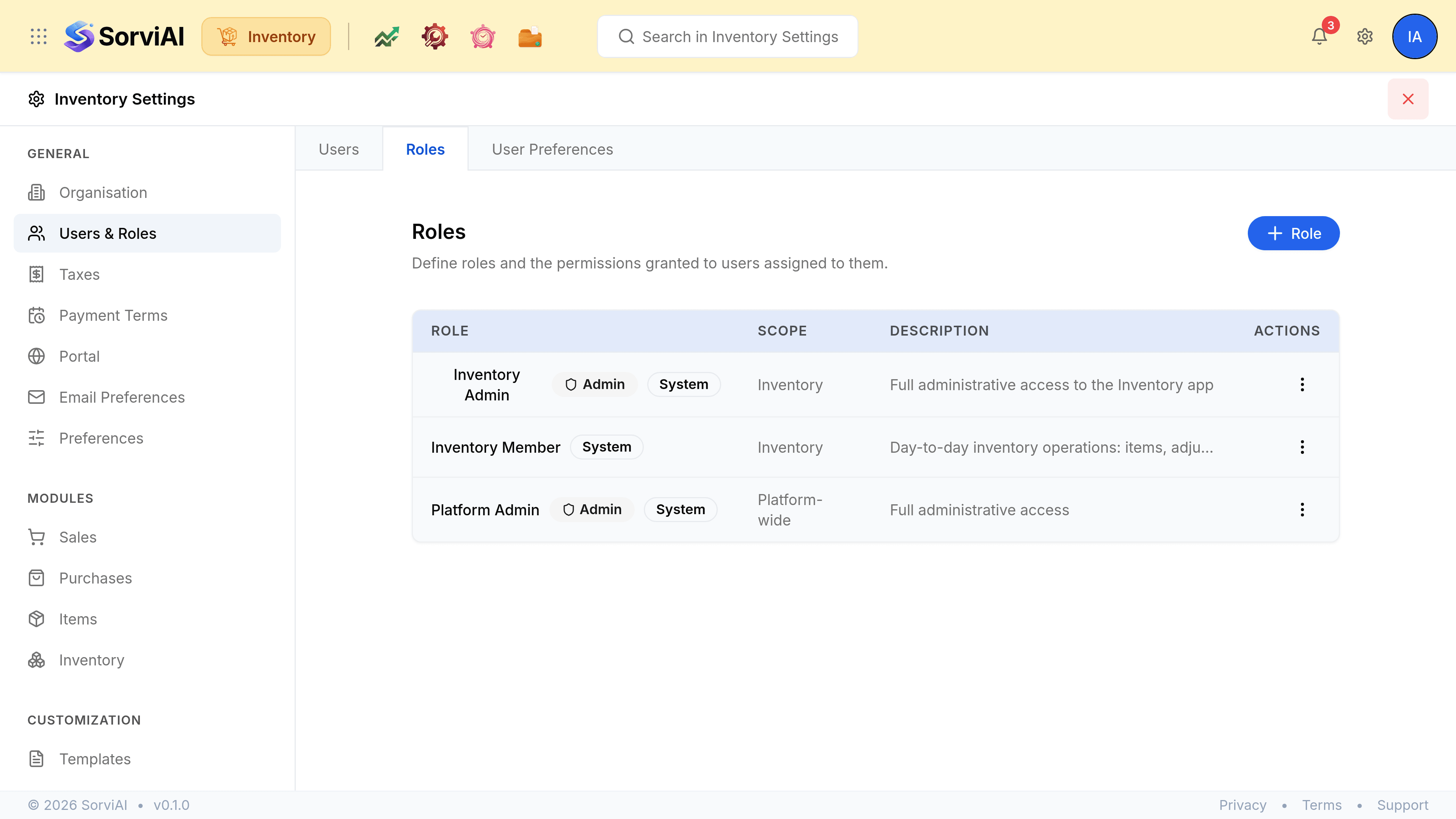 The Roles tab of Users & Roles in Inventory Settings, headed Roles above the line Define roles and the permissions granted to users assigned to them, with a blue Role button at the right. A table with columns ROLE, SCOPE, DESCRIPTION and ACTIONS lists roles carrying Admin and System badges, each showing the app its scope covers and a short description.