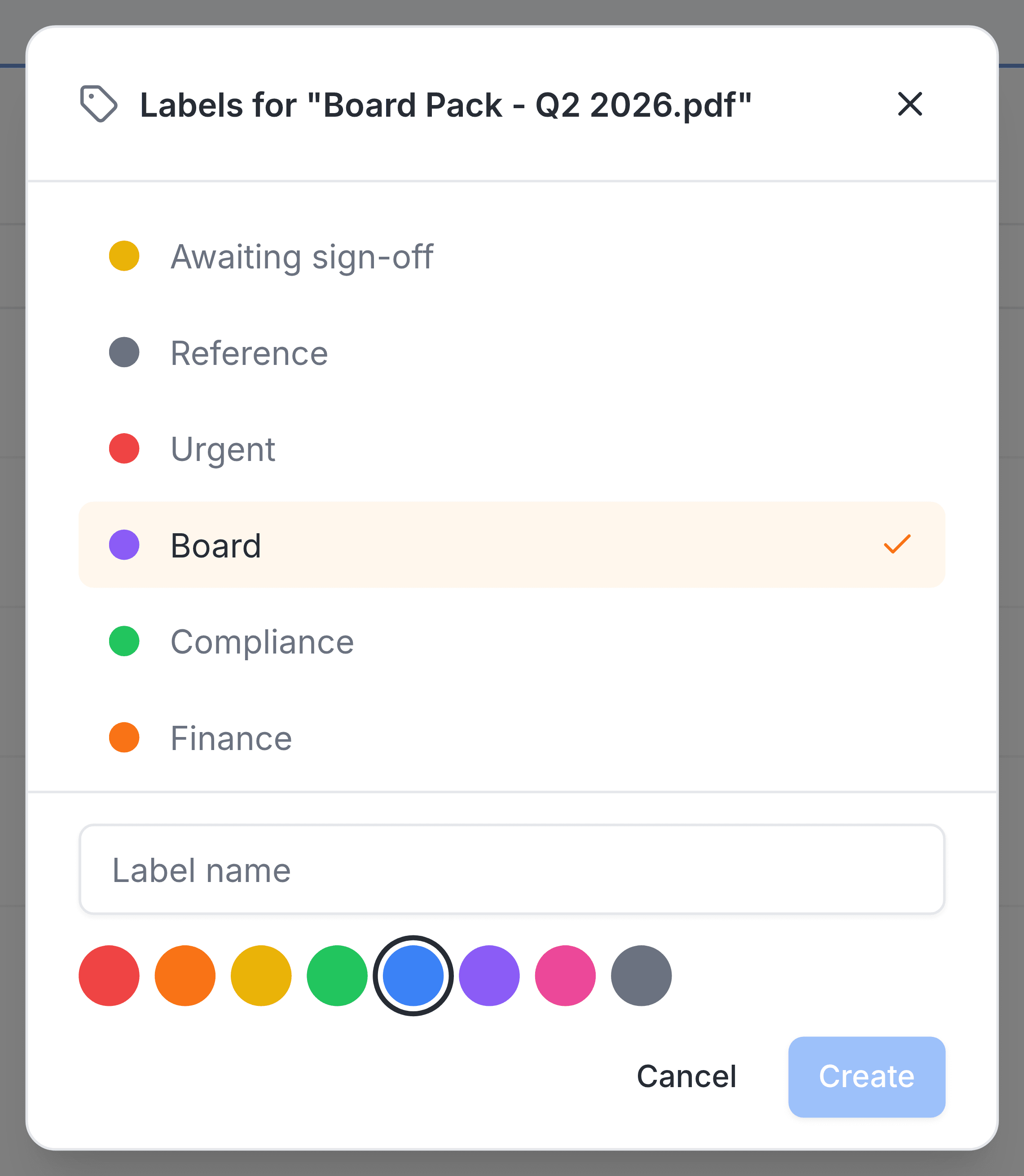 The panel headed Labels for Board Pack - Q2 2026.pdf, listing six labels with Board ticked. At its foot a Label name box, the same eight colour swatches with blue ringed, and Cancel and Create buttons.