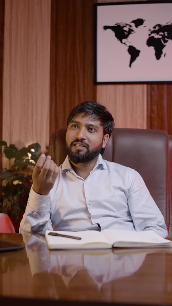 Deepak Gupta, founder of SorviAI, speaking to camera at a desk, with a world map on the wall behind him.