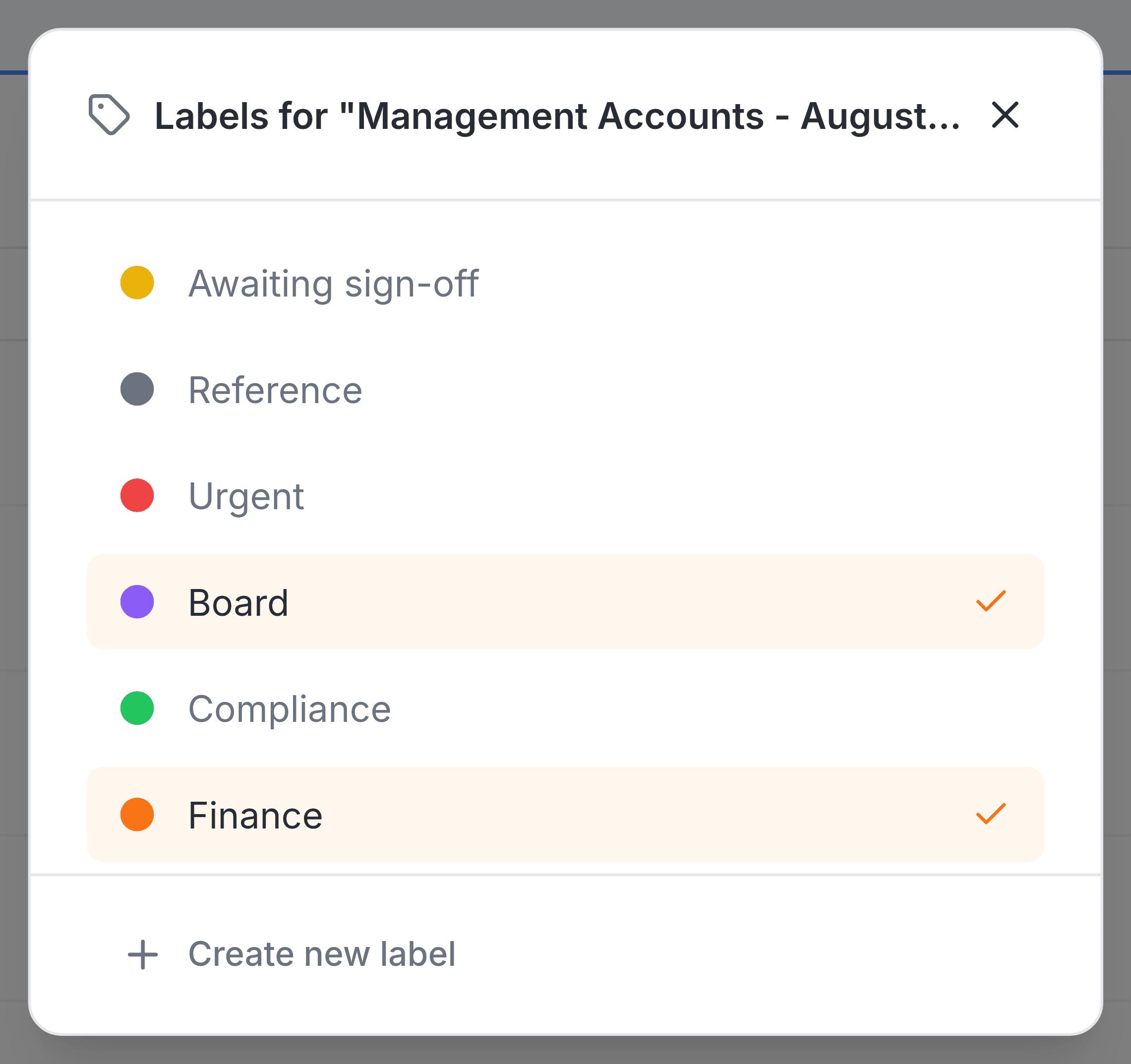 A panel headed Labels for Management Accounts - August 2026.xlsx. It lists six labels, each with a coloured dot: Awaiting sign-off, Reference, Urgent, Board, Compliance and Finance. Board and Finance are highlighted and ticked. Beneath the list is the option Create new label.